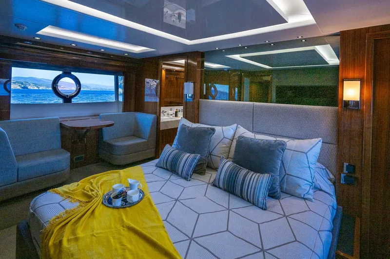 Seawater Yacht Photos Pics Luxurious bedroom interior of 2019 Sunseeker 86 Yacht with ocean view and elegant decor.