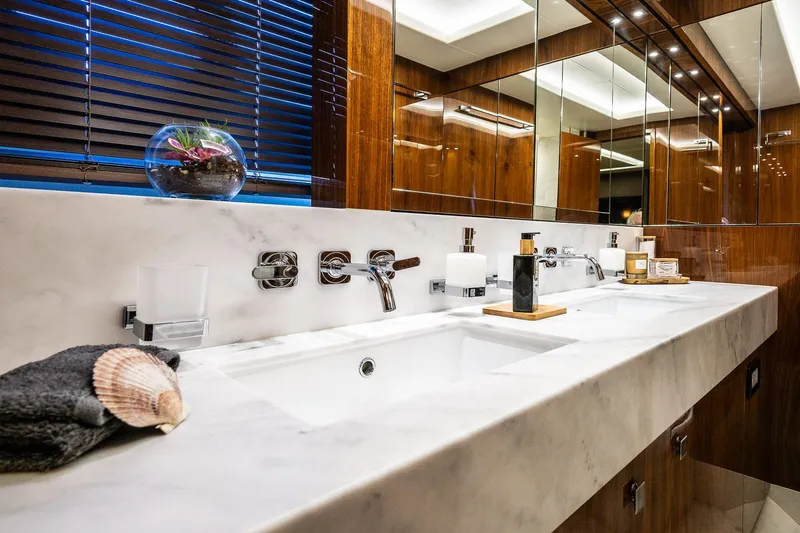 Seawater Yacht Photos Pics Luxurious bathroom interior on a 2019 Sunseeker 86 Yacht, featuring elegant marble countertops.