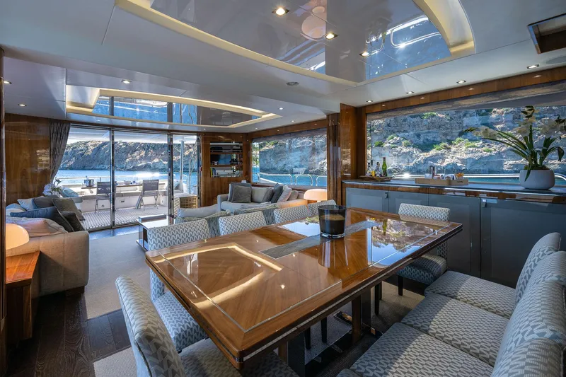 Seawater Yacht Photos Pics Luxurious interior of 2019 Sunseeker 86 Yacht with elegant dining area and scenic views.