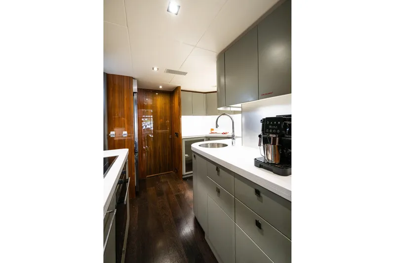Seawater Yacht Photos Pics Luxurious kitchen interior of 2019 Sunseeker 86 Yacht with modern appliances.