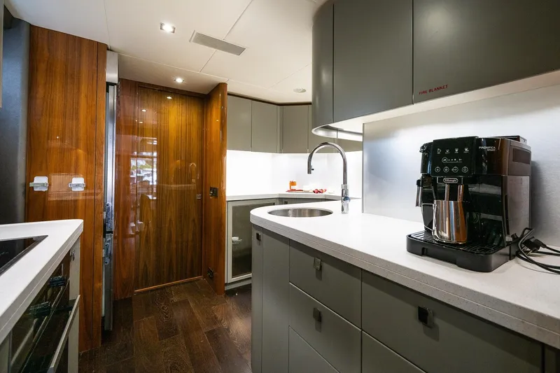 Seawater Yacht Photos Pics Luxurious kitchen interior of 2019 Sunseeker 86 Yacht with modern appliances.