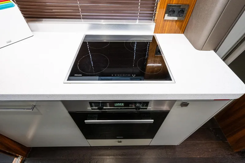 Seawater Yacht Photos Pics Modern kitchen in 2019 Sunseeker 86 Yacht with Miele appliances and sleek design.