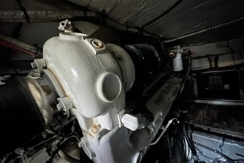 Summer Shack Yacht Photos Pics Engine room of 1988 Hatteras 48 Convertible boat, showcasing mechanical components.