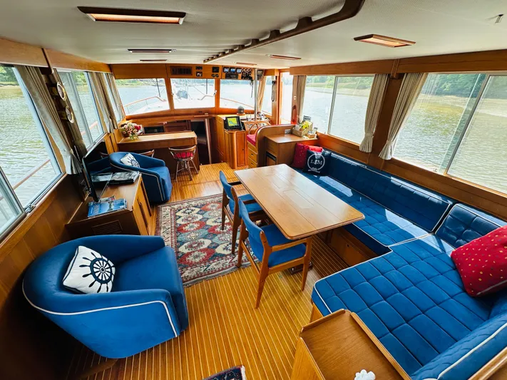Sora Yacht Photos Pics Interior of 1998 Grand Banks 49 Classic yacht with elegant seating and wooden finishes.