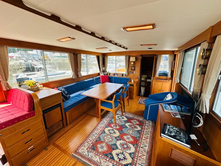 Sora Yacht Photos Pics Interior of 1998 Grand Banks 49 Classic yacht with wood furnishings and cozy seating.