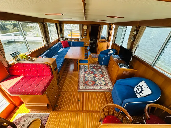 Sora Yacht Photos Pics Spacious interior of a 1998 Grand Banks 49 Classic yacht with elegant wood finishes.