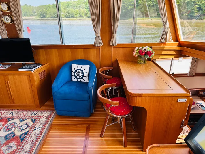 Sora Yacht Photos Pics Interior of 1998 Grand Banks 49 Classic yacht with wooden decor and scenic window view.