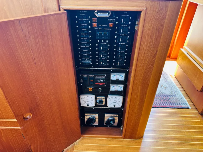 Sora Yacht Photos Pics Electrical panel inside a 1998 Grand Banks 49 Classic yacht, featuring gauges and switches.