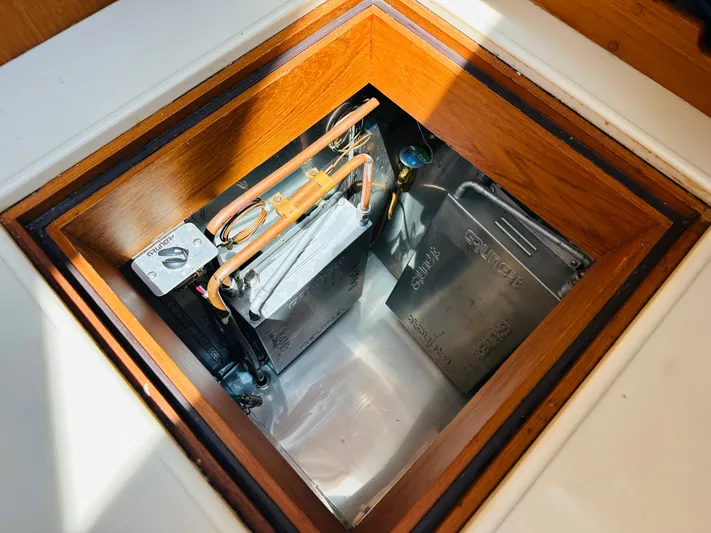 Sora Yacht Photos Pics Engine compartment of 1998 Grand Banks 49 Classic yacht, showcasing mechanical components.