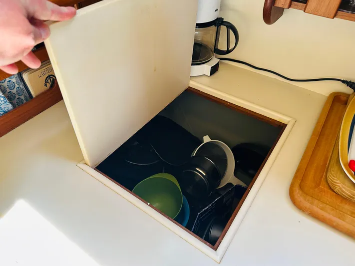 Sora Yacht Photos Pics Hidden storage compartment in 1998 Grand Banks 49 Classic yacht kitchen.