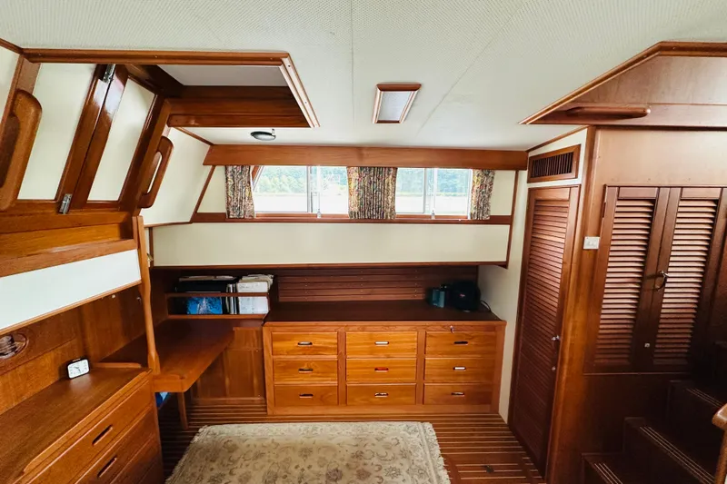 Sora Yacht Photos Pics Interior of 1998 Grand Banks 49 Classic yacht with wooden cabinetry and natural light.