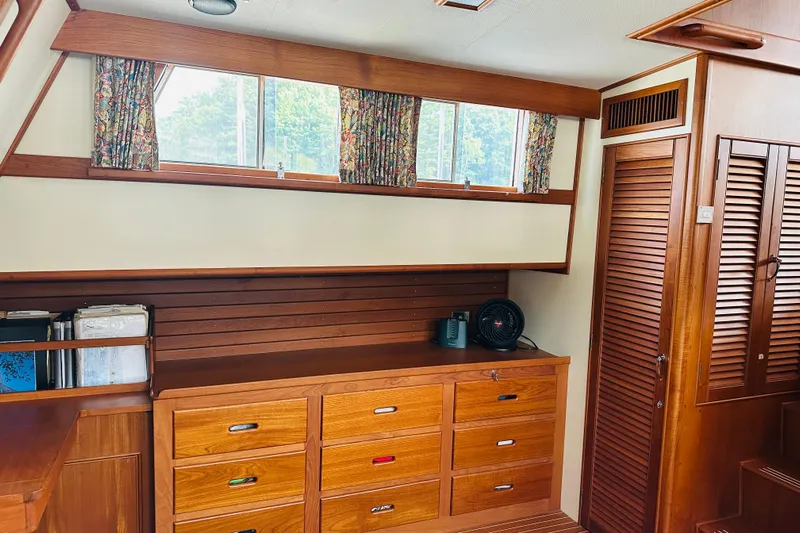 Sora Yacht Photos Pics Interior of 1998 Grand Banks 49 Classic yacht with wooden cabinetry and windows.