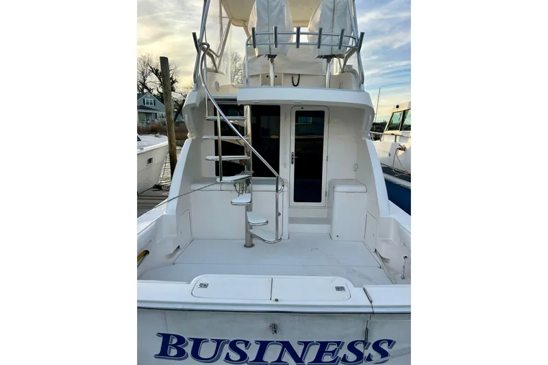  Yacht Photos Pics 2005 Bertram 390 Convertible yacht with spiral staircase and spacious deck.