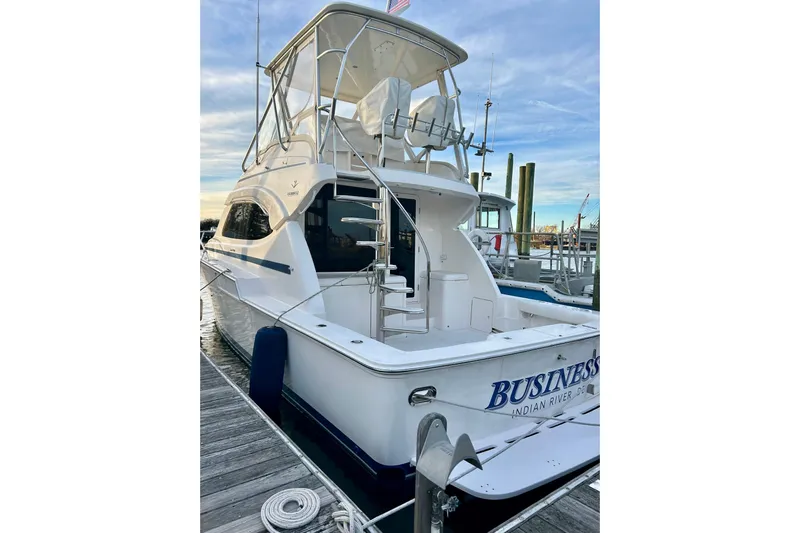  Yacht Photos Pics 2005 Bertram 390 Convertible yacht docked at marina, rear view.