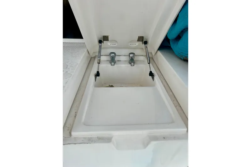  Yacht Photos Pics Open hatch with faucet on 2005 Bertram 390 Convertible boat.