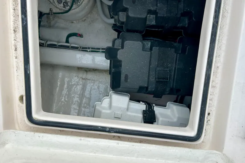  Yacht Photos Pics Battery compartment of a 2005 Bertram 390 Convertible boat, showing wiring and battery cases.