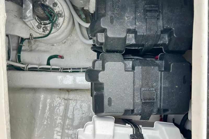  Yacht Photos Pics Battery compartment of a 2005 Bertram 390 Convertible boat, showing wiring and battery cases.
