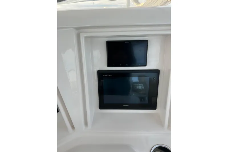  Yacht Photos Pics Garmin displays on 2005 Bertram 390 Convertible boat dashboard.