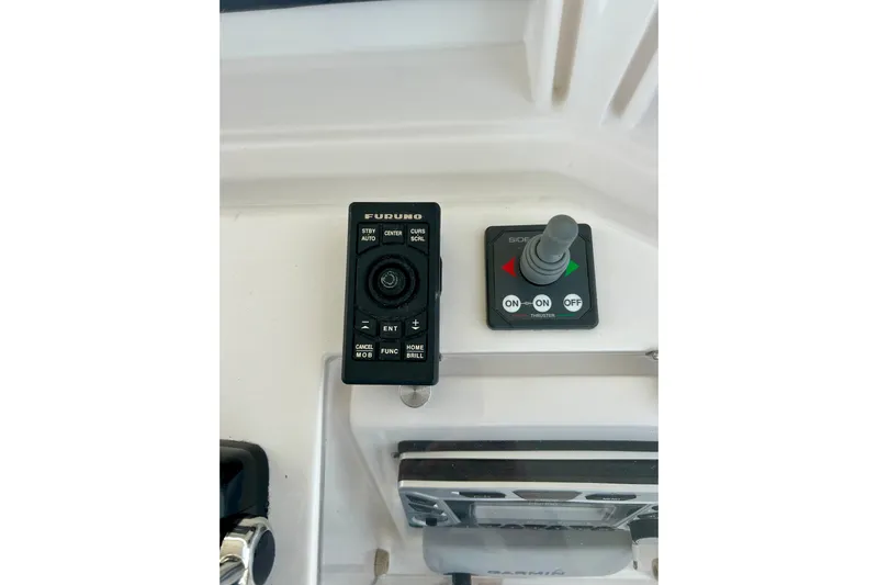  Yacht Photos Pics Control panel of a 2005 Bertram 390 Convertible boat with Furuno and Side-Power systems.