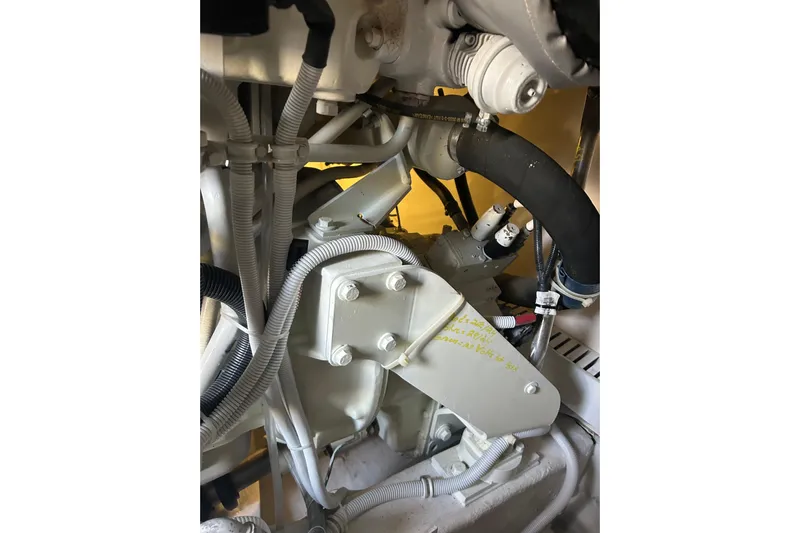  Yacht Photos Pics Engine components of a 2005 Bertram 390 Convertible boat, featuring hoses and wiring.