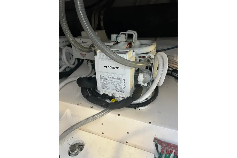  Yacht Photos Pics Dometic unit in 2005 Bertram 390 Convertible engine room with hoses and wiring.