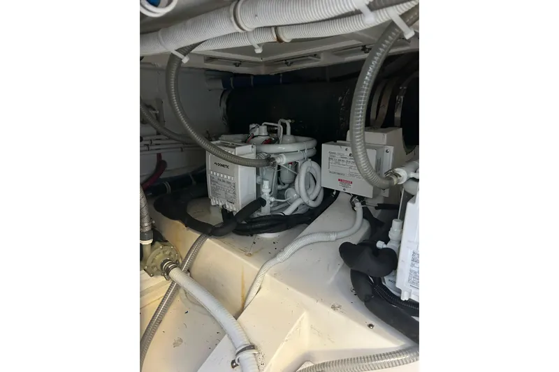  Yacht Photos Pics Engine room of 2005 Bertram 390 Convertible with visible wiring and equipment.