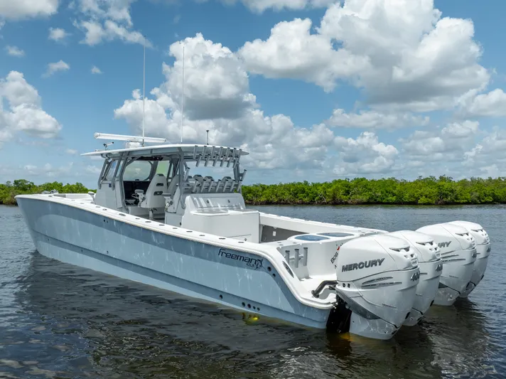  Yacht Photos Pics 2019 Freeman 42 LR boat with Mercury engines on calm water.