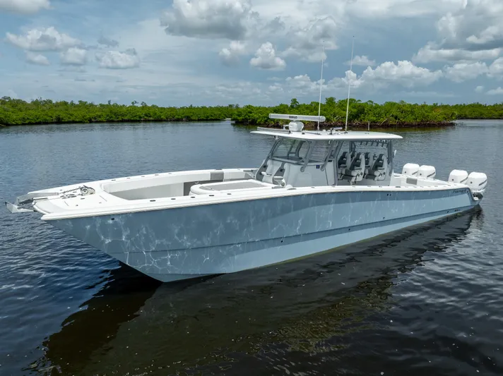  Yacht Photos Pics 2019 Freeman 42 LR boat on calm water with cloudy sky background.