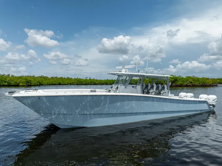  Yacht Photos Pics 2019 Freeman 42 LR boat on calm water with a scenic background.