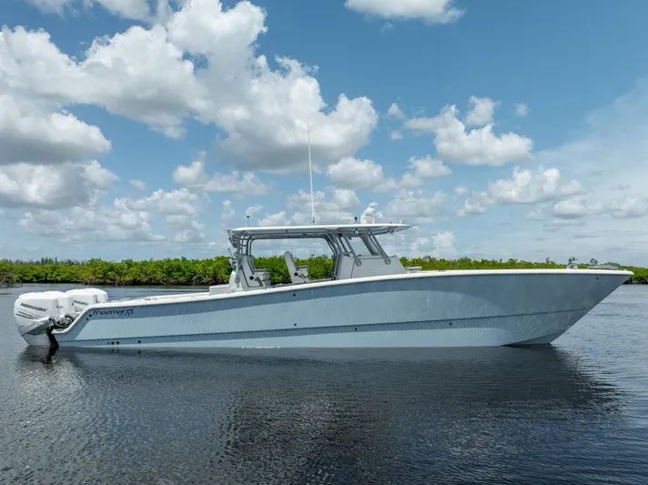  Yacht Photos Pics 2019 Freeman 42 LR boat on calm water with a cloudy sky background.