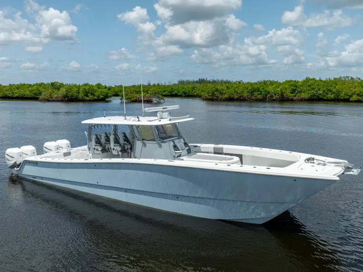  Yacht Photos Pics 2019 Freeman 42 LR boat on calm water with lush green background.