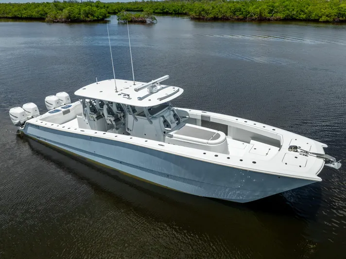  Yacht Photos Pics 2019 Freeman 42 LR boat on calm water with lush green background.