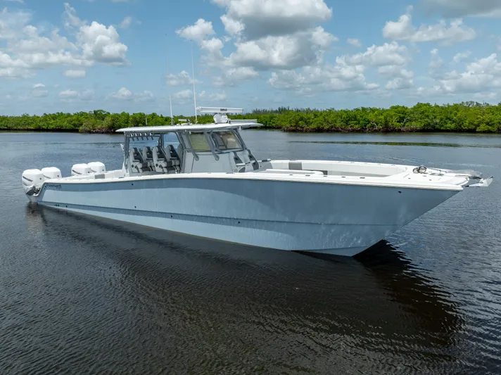  Yacht Photos Pics 2019 Freeman 42 LR boat on calm water with blue sky and clouds.