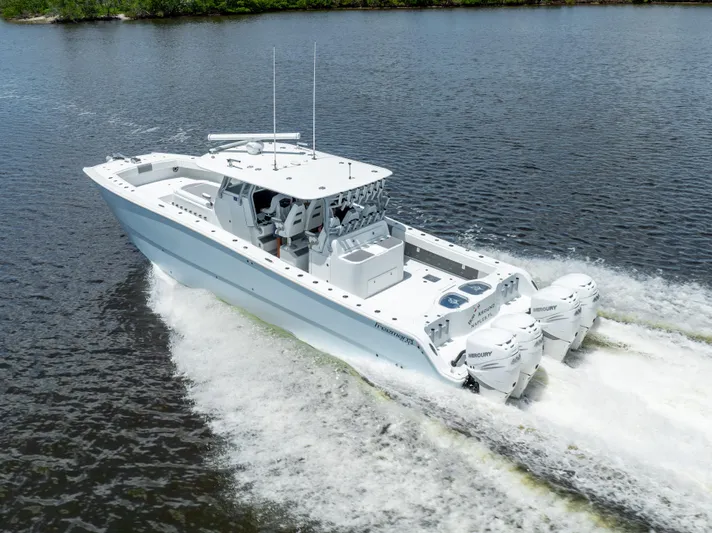  Yacht Photos Pics 2019 Freeman 42 LR boat cruising on water with twin outboard engines.