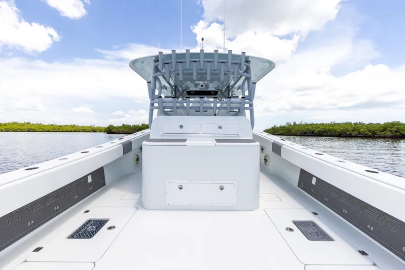  Yacht Photos Pics 2019 Freeman 42 LR boat interior with open deck and blue sky background.