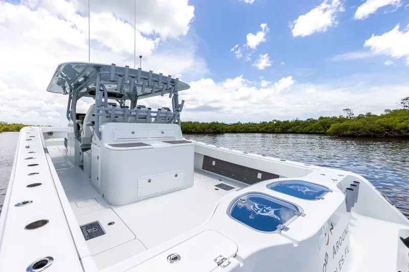  Yacht Photos Pics 2019 Freeman 42 LR boat on a calm river under a blue sky.
