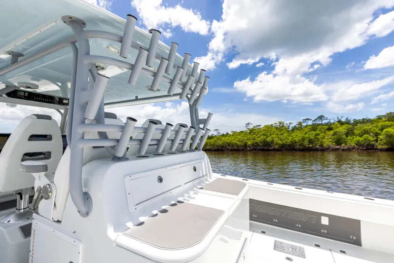  Yacht Photos Pics 2019 Freeman 42 LR boat with rod holders on a sunny day.