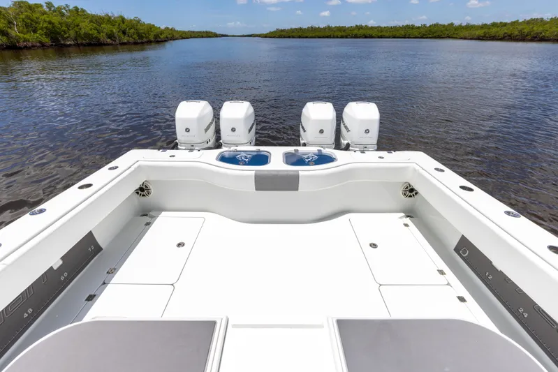  Yacht Photos Pics 2019 Freeman 42 LR boat with quad outboard engines on calm water.