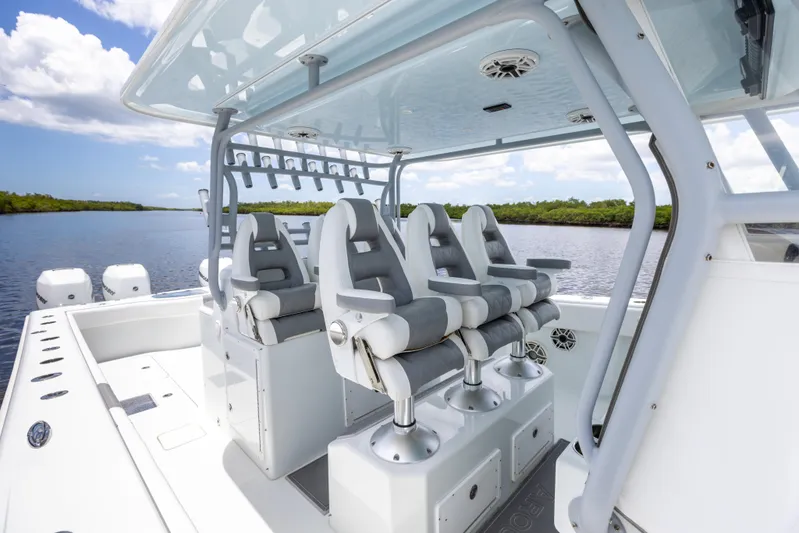  Yacht Photos Pics 2019 Freeman 42 LR boat with four cushioned seats on a sunny day.