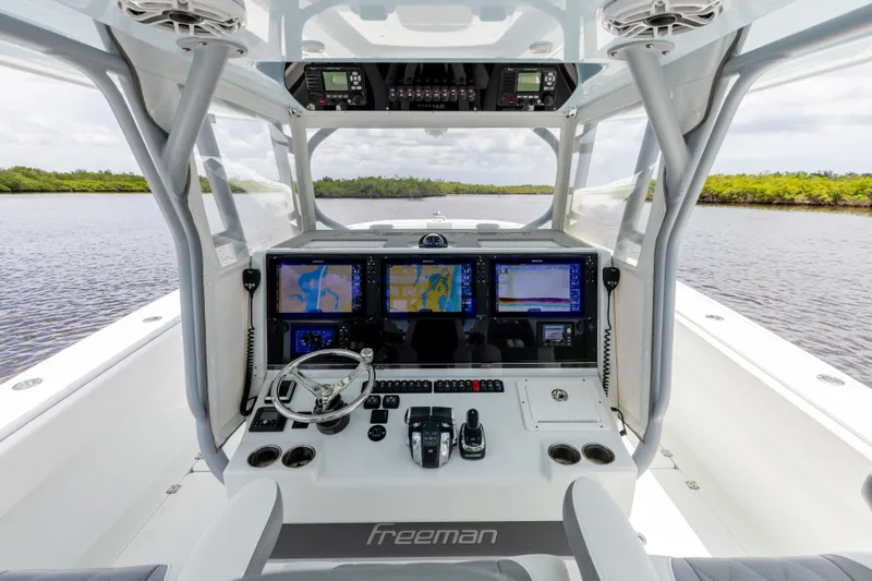  Yacht Photos Pics 2019 Freeman 42 LR boat cockpit with advanced navigation systems and controls.