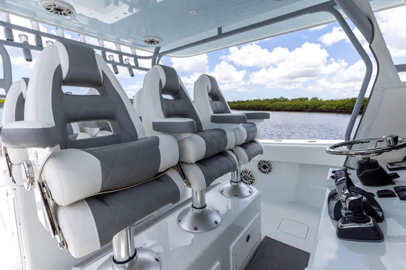  Yacht Photos Pics Luxury seating on a 2019 Freeman 42 LR boat with scenic water view.