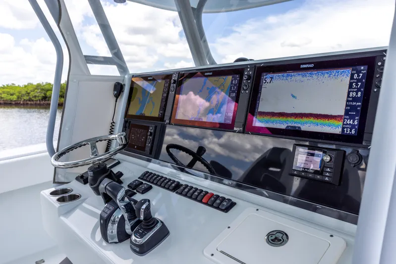  Yacht Photos Pics Control panel of a 2019 Freeman 42 LR boat with navigation and fish-finding equipment.