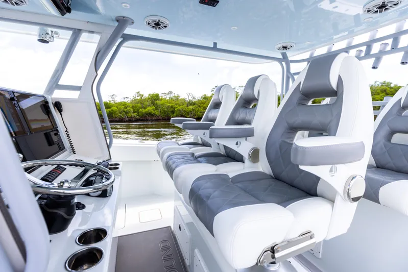  Yacht Photos Pics 2019 Freeman 42 LR boat interior with luxury seating and modern controls.