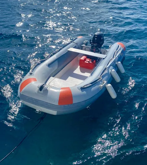 Navillus-3 Yacht Photos Pics Inflatable boat on water, featuring a motor and safety equipment, 2022 Lagoon 46 model.