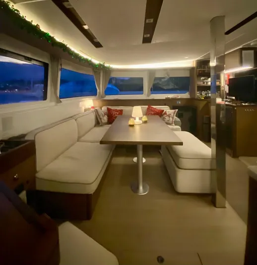Navillus-3 Yacht Photos Pics Interior of 2022 Lagoon 46 yacht with elegant seating and ambient lighting.