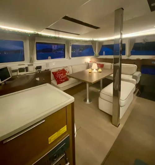 Navillus-3 Yacht Photos Pics Interior of 2022 Lagoon 46 catamaran with modern seating and ambient lighting.