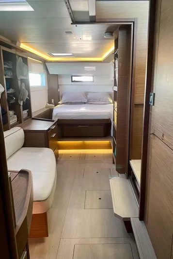 Navillus-3 Yacht Photos Pics Luxurious interior of a 2022 Lagoon 46 catamaran with modern furnishings and ambient lighting.
