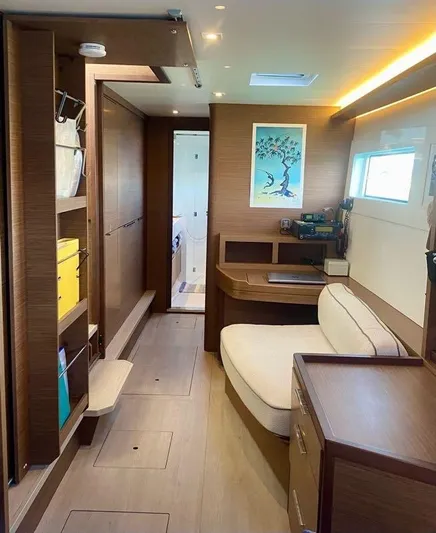 Navillus-3 Yacht Photos Pics Interior of 2022 Lagoon 46 yacht with modern wood finish and cozy seating area.