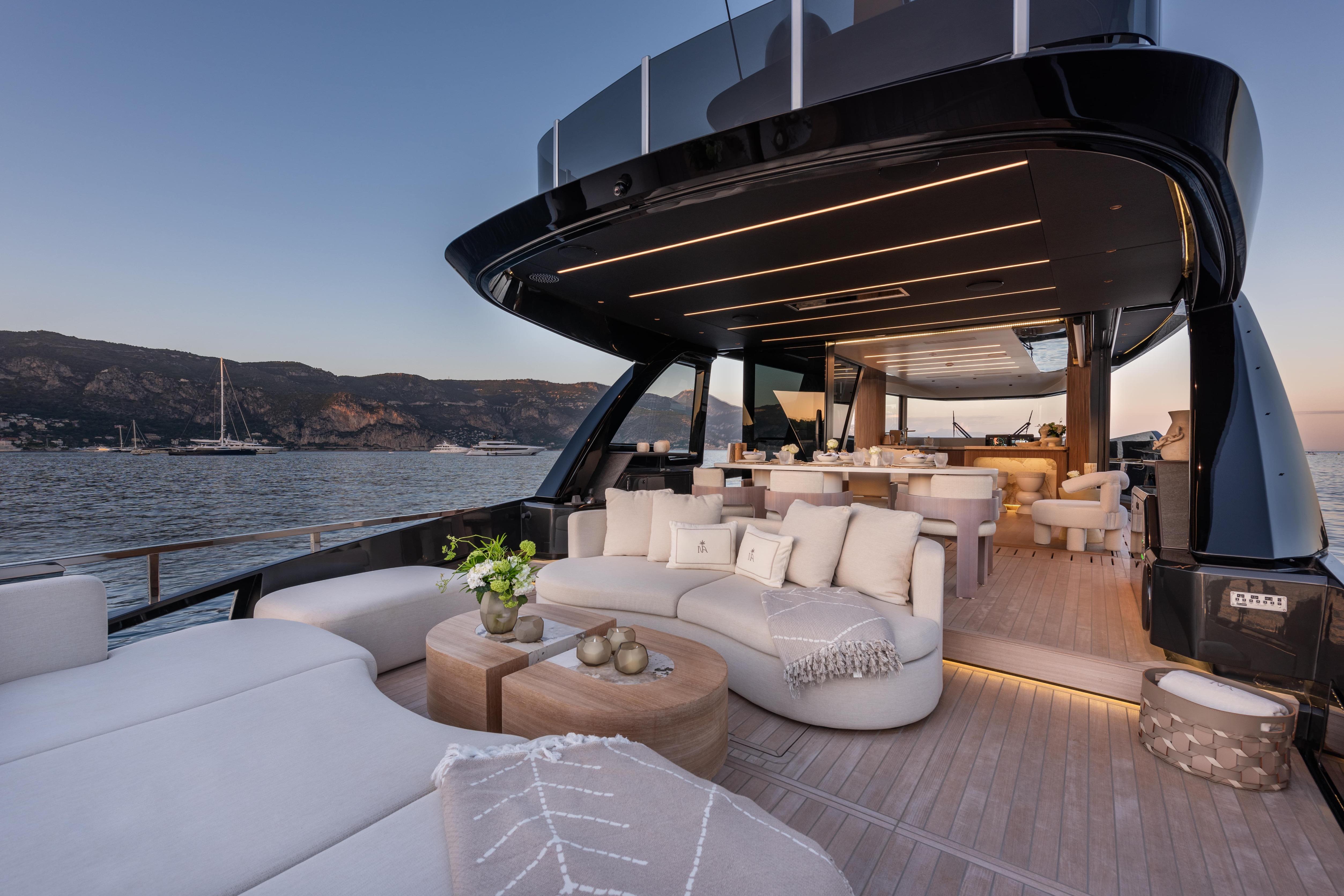Luxurious 2025 Explorer 62 yacht with elegant outdoor seating and scenic ocean view.