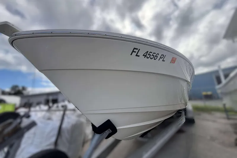  Yacht Photos Pics 2013 Andros Offshore 32 boat on trailer, cloudy sky background.